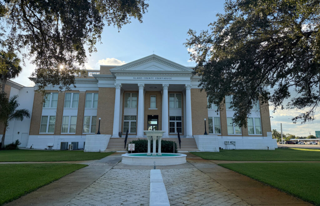The columned entrance and fountain at the Glades County Courthouse in Moore Haven, Florida.