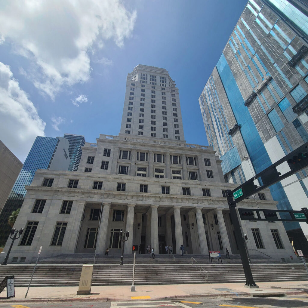 A street view of the historic Miami-Dade County Courthouse tower at 73 West Flagler Street in downtown Miami.